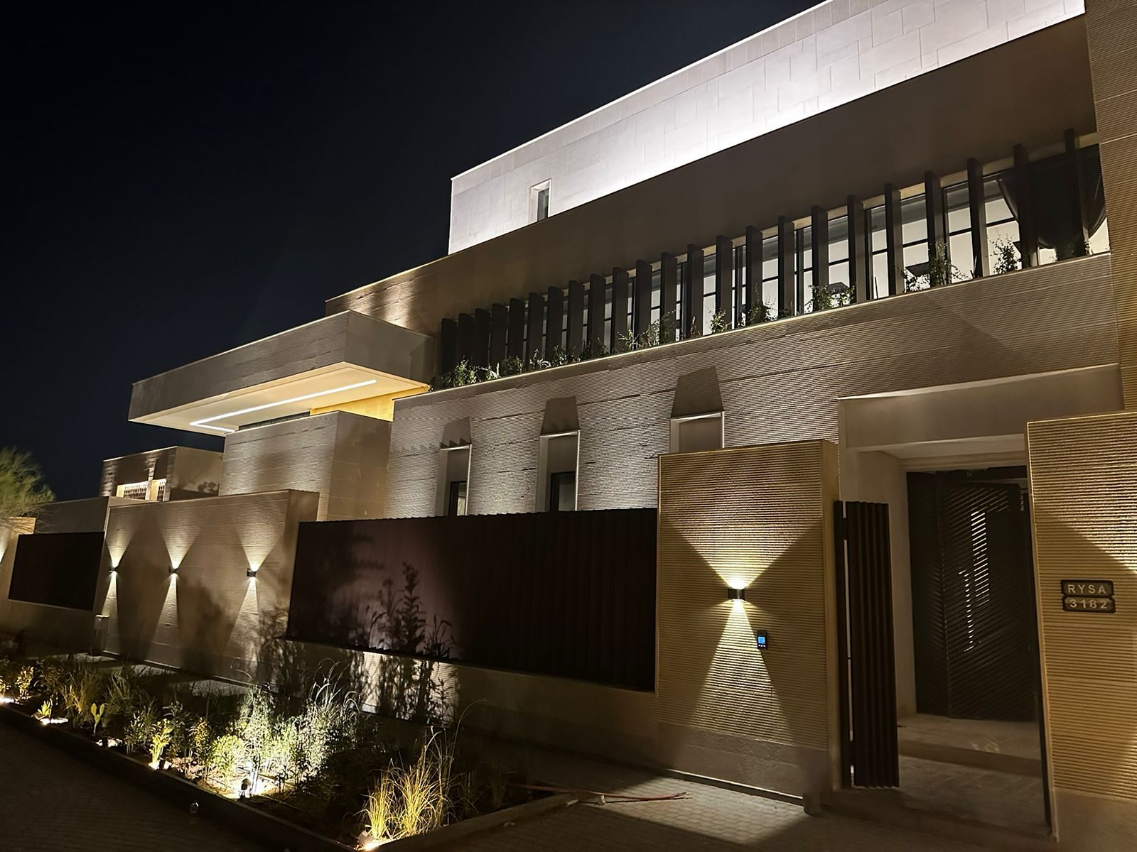 Modern villa exterior with facade lighting, Riyadh